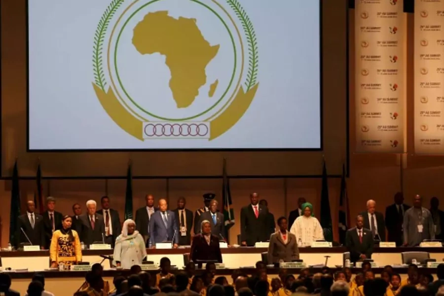 Leaders of the AU stand during the opening of the 25th African Union summit in Johannesburg June 14, 2015. A South African cou...e was attending an African Union summit, until the judge hears an application calling for his arrest. (Siphiwe Sibeko/Reuters)