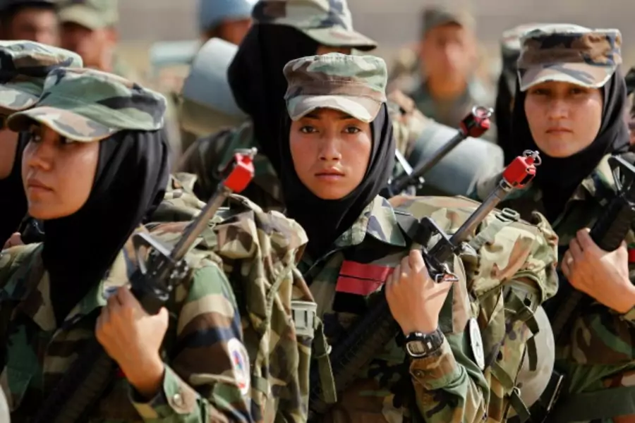Afghan National Army (ANA) female officers take part in a training exercise at the Kabul Military Training Centre (KMTC) in Kabul, October 8, 2013. (Omar Sobhani/Reuters)