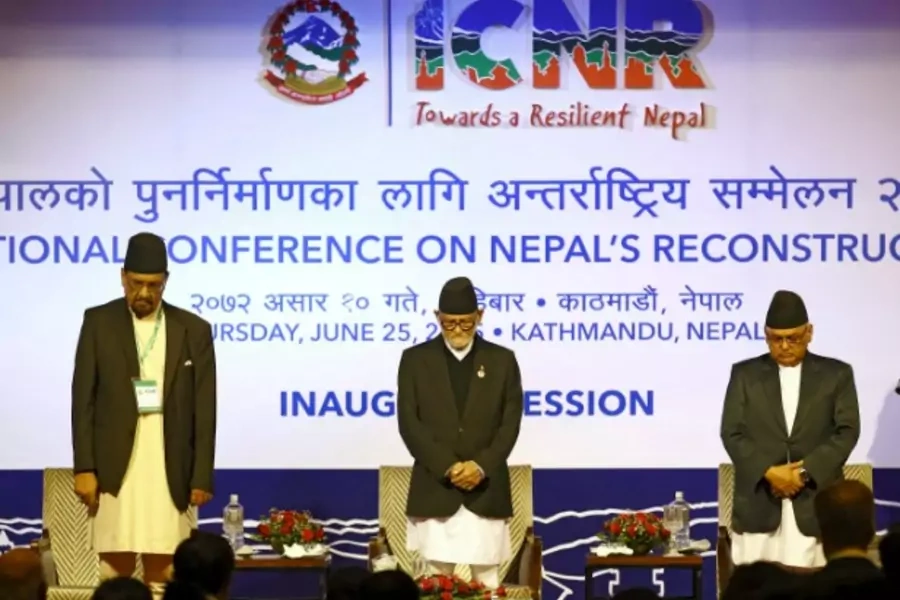 Nepal's Prime Minister Sushil Koirala greets upon his arrival to take part in the International Conference of Nepal Reconstruc...aid pledge from the donors taking part in the conference for rebuilding Nepal after the earthquake. (Navesh Chitrakar/Reuters)