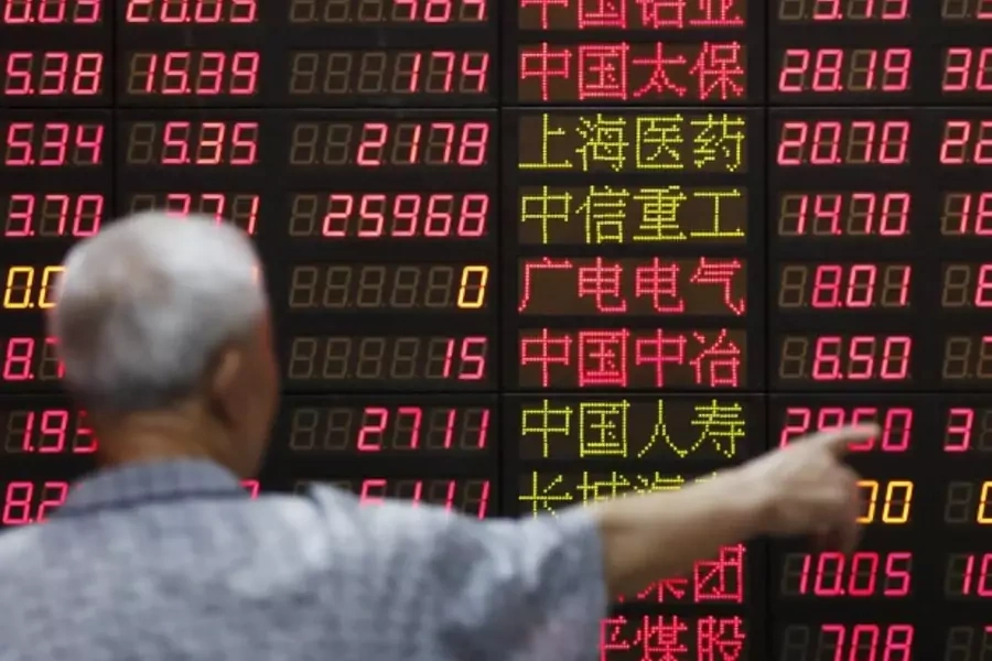 An investor looks at information displayed on an electronic screen at a brokerage house in Shanghai, China, June 30, 2015. Chi...of government measures to stem a two-week-long market tumble appeared to win back some investor confidence (Aly Song/Reuters).