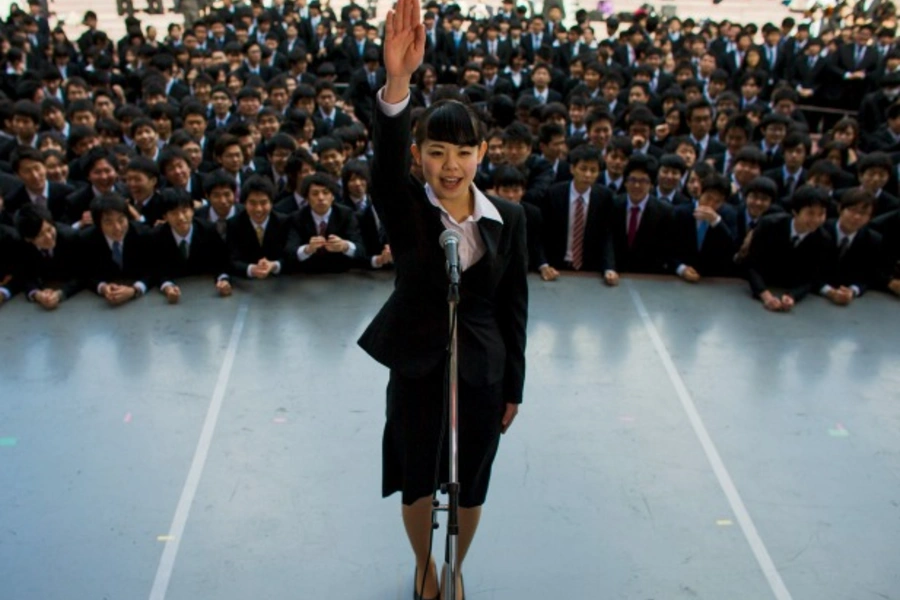 Japanese college graduates attend a pep rally in Tokyo designed to boost their morale as they break into the job market, February 2015 (Thomas Peter/Reuters).