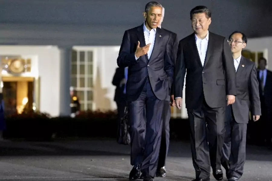 U.S. President Barack Obama (L) chats with Chinese President Xi Jinping as they walk from the West Wing of the White House to ...pying, Beijing's economic policies and territorial disputes in the South China Sea. REUTERS/Mike Theiler TPX IMAGES OF THE DAY