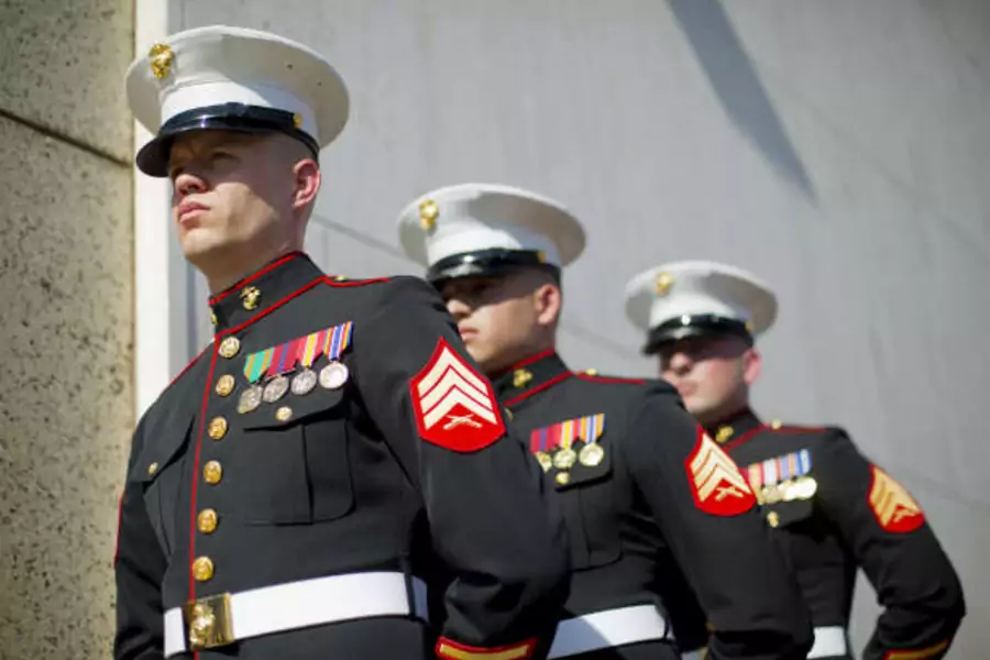 U.S. Marines, currently stationed in Cuba, stand at the ready for the raising of the U.S. flag over the newly reopened embassy in Havana, Cuba, August 14, 2015. (REUTERS/Pablo Martinez Monsivais/Pool)