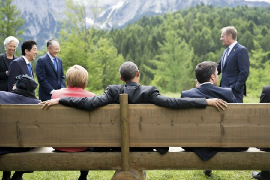 U.S. President Barack Obama, German Chancellor Angela Merkel, and other leaders of the Group of Seven (G7) nations sit together at the forum's 2015 summit in Germany.