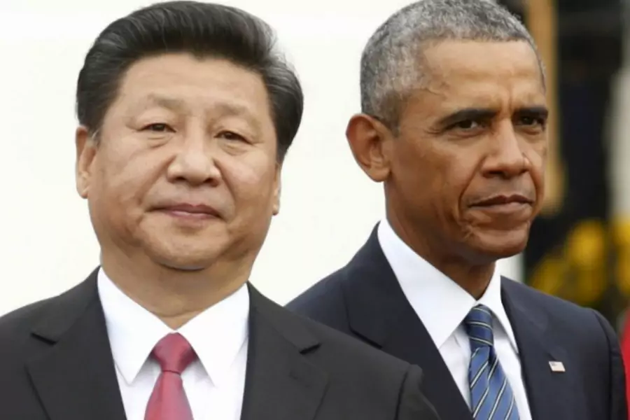 U.S. President Barack Obama stands with Chinese President Xi Jinping during an arrival ceremony at the White House in Washingt...eptember 25, 2015. Later that day, the two leaders announced a landmark agreement on cyber espionage. (Kevin Lamarque/Reuters)