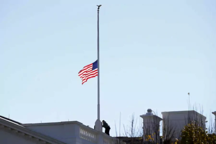 The flag over the White House is lowered to half staff to honor the victims of the San Bernardino, California shootings. (Kevin Lamarque/Courtesy Reuters)
