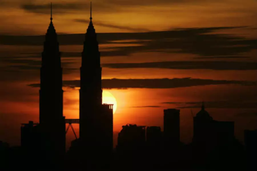 Sun sets over Petronas Twin Towers in Kuala Lumpur (Zainal Abd Halim/Courtesy Reuters)
