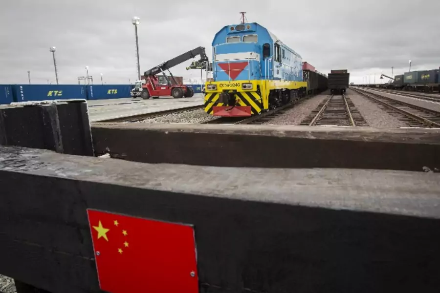 A Chinese flag marking a railway linked to China is seen in front of a train at the Khorgos border crossing point, east of the...egulations that hurt its reputation as a cross-border trading partner. Picture taken October 19, 2015. REUTERS/Shamil Zhumatov