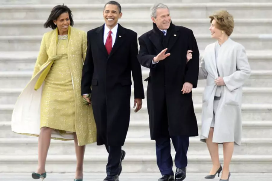 President Barack Obama and First Lady Michelle Obama walk out to the presidential helicopter with former President George W. Bush and his wife Laura after President Obama’s inauguration in 2009. (Tannen Maury/Reuters)