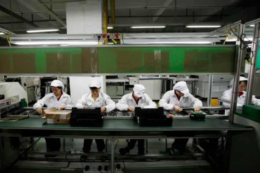 Workers are seen inside a Foxconn factory in the township of Longhua in the southern Guangdong province May 26, 2010. A spate ...nes, has cast a spotlight on some of the harsher aspects of blue-collar life on the Chinese factory floor (Reuters/Bobby Yip).
