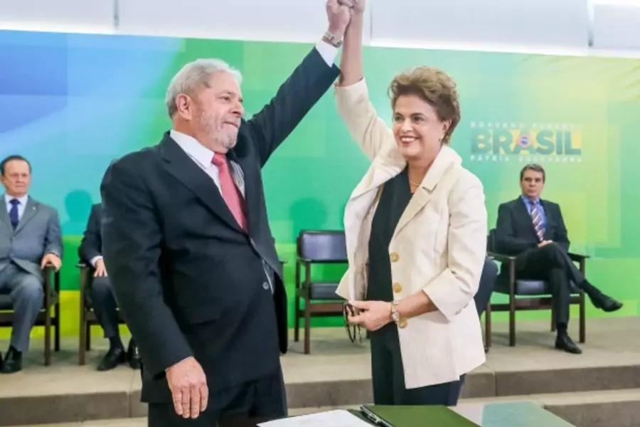 Brazil's President Dilma Rousseff (R) greets former president Luiz Inacio Lula da Silva during the appointment of Lula da Silva as chief of staff, at Planalto palace in Brasilia, Brazil (Reuters/Adriano Machado).