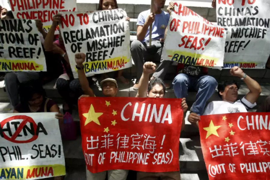 Filipino activists protest Chinese reclamation in the South China Sea outside the Chinese embassy in Manila on April 17, 2015.