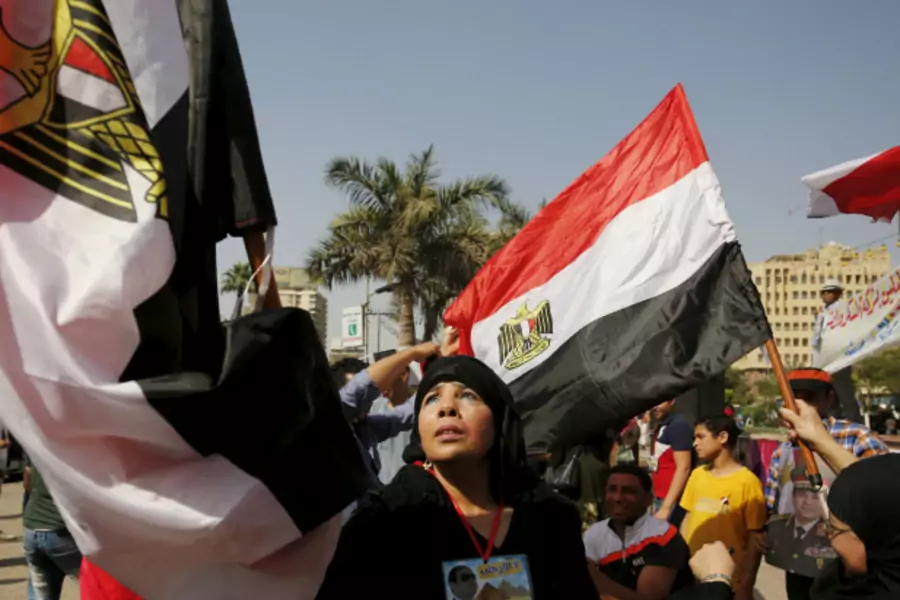 Supporters of Egypt's army and Egyptian President Abdel Fattah al-Sisi dance and cheer as they celebrate the anniversary of Sinai Liberation Day in Cairo, Egypt (Amr Abdallah Dalsh/Reuters).