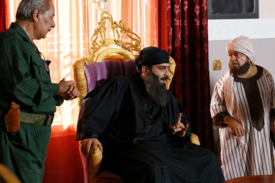 A view shows actors during the filming of the set of the television series, whose title is loosely translated as "State of Myths" in Baghdad (Thaier Al-Sudani/Reuters).