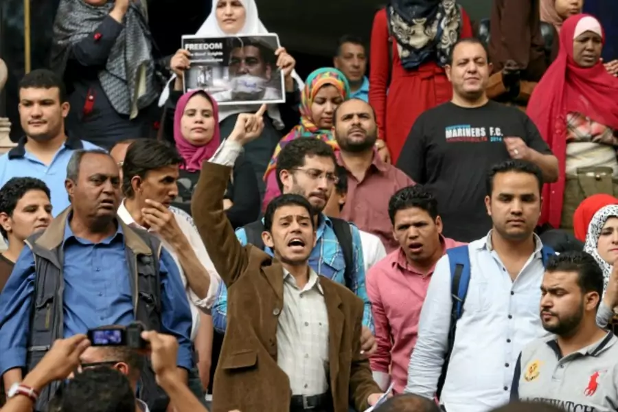 Journalists and activists protest against the restriction of press freedom and to demand the release of detained journalists, in front of the Press Syndicate in Cairo, Egypt (Mohamed Abd El Ghany/Reuters).