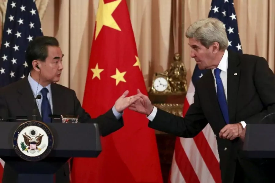 U.S. Secretary of State John Kerry (R) and Chinese Foreign Minister Wang Yi hold a joint news conference after their meeting at the State Department in Washington, February 23, 2016. REUTERS/Yuri Gripas TPX IMAGES OF THE DAY