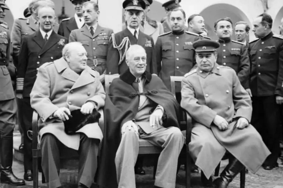 Winston Churchill, Franklin D. Roosevelt, and Joseph Stalin sit for photographs during the Yalta Conference in February 1945.
