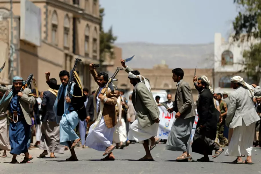 Tribesmen loyal to the Houthi movement perform the Baraa dance during a gathering to show support to the movement in Sanaa, Yemen (Khaled Abdullah/Reuters).