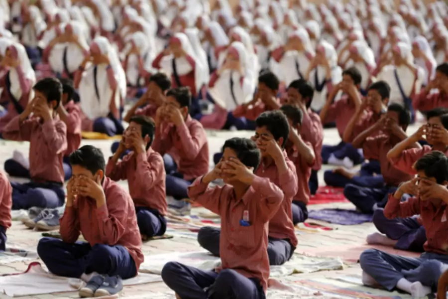 Students practice yoga during a training session ahead of World Yoga Day in Ahmedabad, India, June 16, 2016. (Amit Dave/Reuters)
