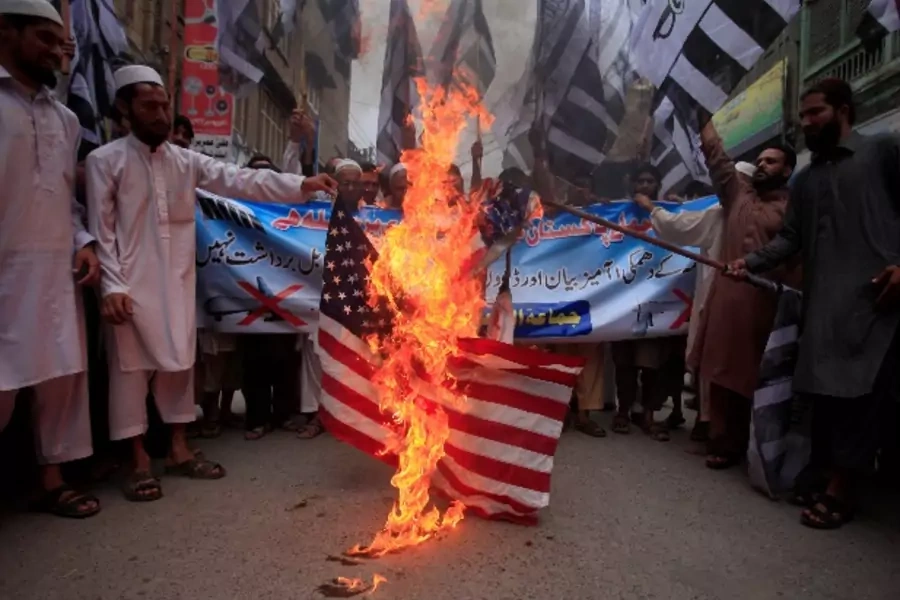 Jamaat-ud-Dawa-burn-flag-protest