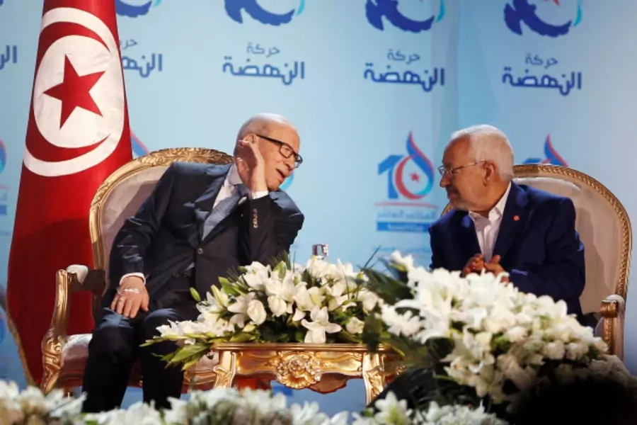 2016Tunisian President Beji Caid Essebsi (L), talks with Rached Ghannouchi, leader of the Islamist Ennahda movement, during the congress of the Ennahda Movement in Tunis, Tunisia (Zoubeir Souissi/Reuters).