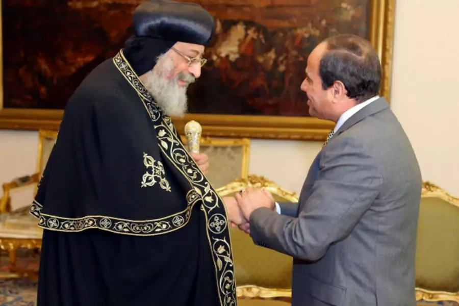 Egyptian President Abdel Fattah al-Sisi greets Egyptian Coptic Pope Tawadros II, head of the Egyptian Coptic Orthodox Church, at the Ittihadiya presidential palace in Cairo (Handout/Reuters).