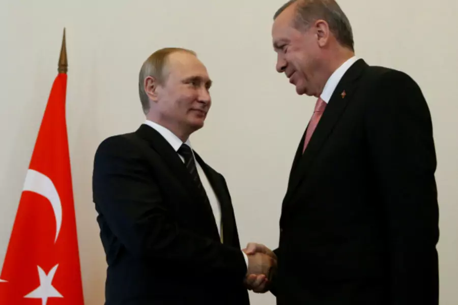 Russian President Vladimir Putin shakes hands with Turkish President Tayyip Erdogan during their meeting in St. Petersburg, Russia (Sergei Karpukhin/Reuters).