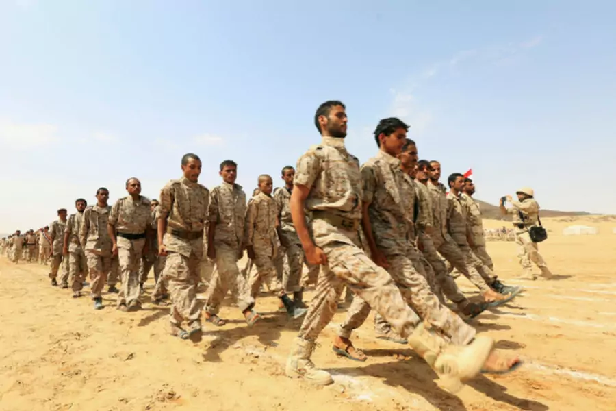 Pro-government soldiers march during a military parade celebrating the 54th anniversary of North Yemen's revolution in the central province of Marib (Ali Owidha/Reuters).