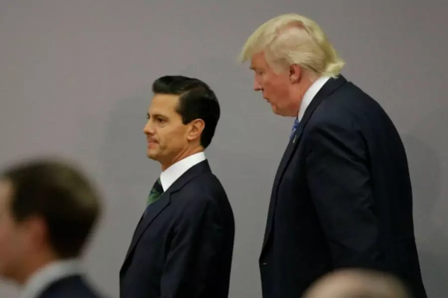 U.S. Republican presidential nominee Donald Trump and Mexico's President Enrique Pena Nieto walk out after finishing a press conference at the Los Pinos residence in Mexico City, Mexico, August 31, 2016 (Reuters/Henry Romero).