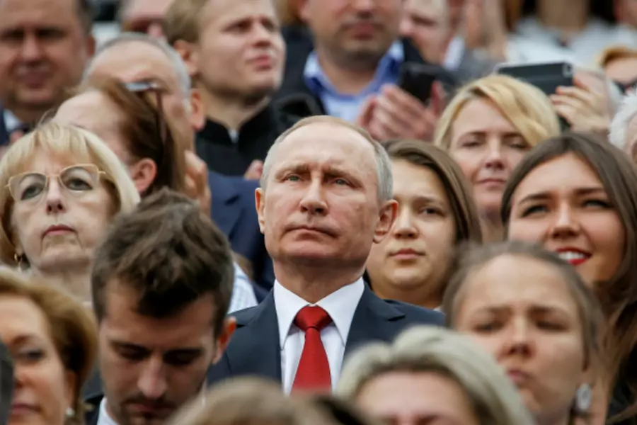 Russian President Vladimir Putin watches the celebrations for the City Day in Moscow, Russia (Sergei Karpukhin/Reuters).