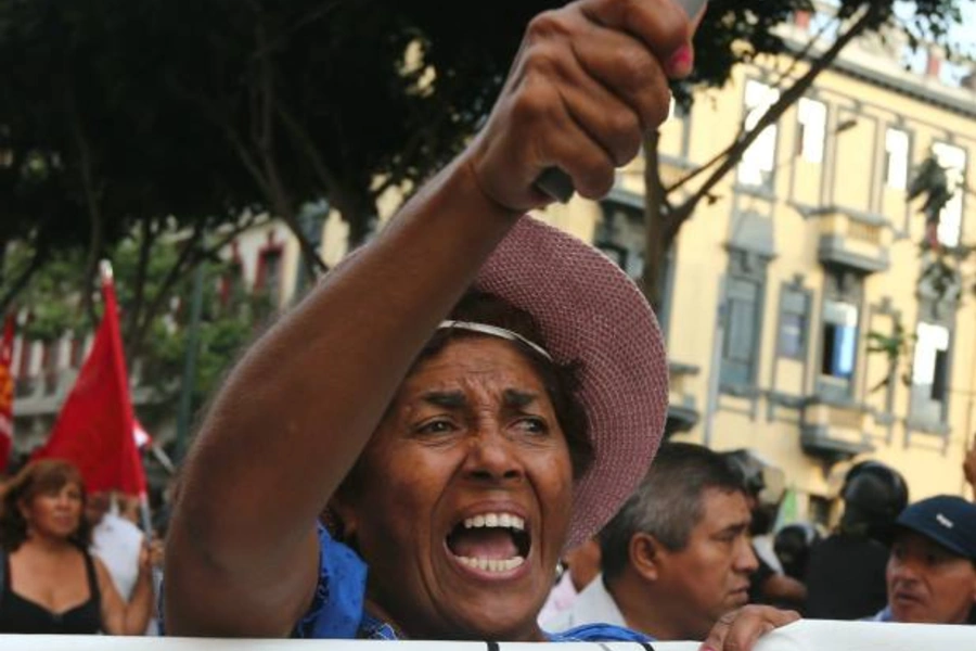 People take part in a protest against corruption in Lima, Peru after a scandal involving bribes Brazil's Odebrecht distributed in Peru, February 16, 2017 (Guadalupe Pardo/Reuters).