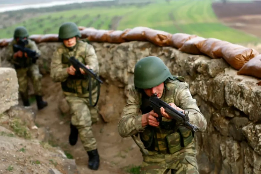 Turkish soldiers participate in an exercise on the border line between Turkey and Syria near the southeastern city of Kilis, Turkey (Murad Sezer/Reuters).