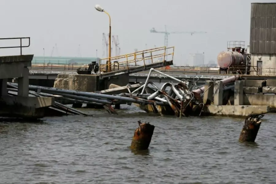 An oil discharge facility which was used to transfer imported oil from ships at the Atlas Cove depot, is seen damaged after militants from the Niger delta bombed it, in Lagos, Nigeria, November 10, 2016.