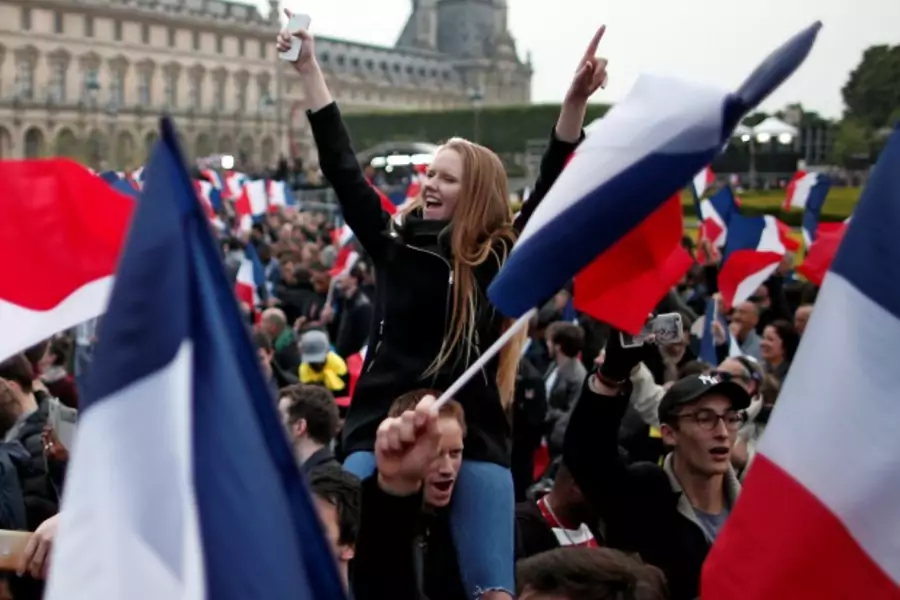 Supporters of Emmanuel Macron celebrate near the Louvre museum. 