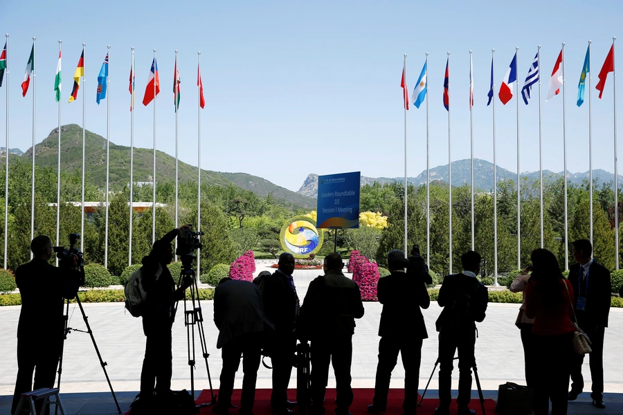 Journalists take pictures outside the venue of a summit at the Belt and Road Forum in Beijing, China, May 15, 2017.