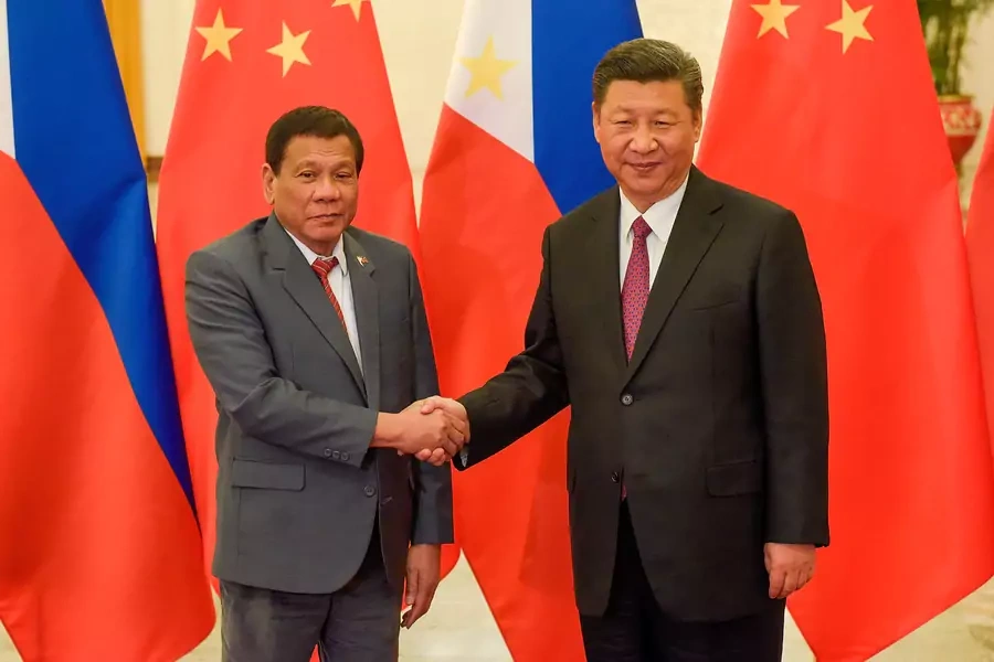 Chinese President Xi Jinping (R) shakes hands with Philippines President Rodrigo Duterte prior to their bilateral meeting during the Belt and Road Forum, at the Great Hall of the People in Beijing, China May 15, 2017. 
