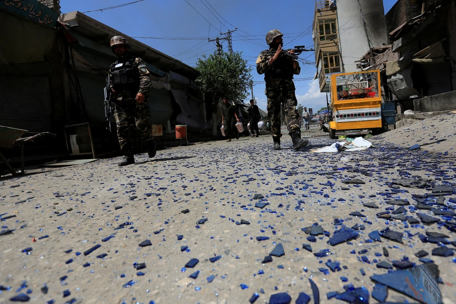 Afghan security forces keep guard at the site of an attack after gunmen attack in Jalalabad, Afghanistan.