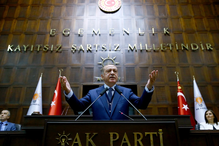 Turkish President Tayyip Erdogan addresses members of parliament from his ruling AK Party (AKP) during a meeting at the Turkish parliament (Kayhan Ozer/Presidential Palace/Handout/Reuters).