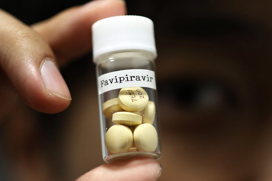 Tablets of Avigan (generic name: Favipiravir), a drug approved as an anti-influenza drug in Japan and developed by a subsidiary of Fujifilm Holdings, are displayed during a photo opportunity at Fujifilm’s headquarters in Tokyo on October 22, 2014.