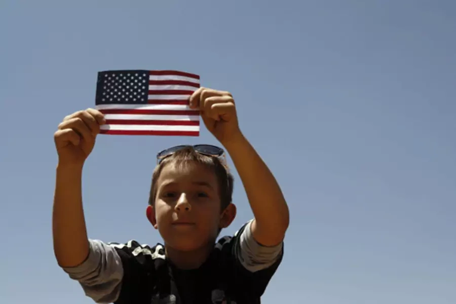 A boy listens to U.S. President Barack Obama speak on immigration reform at Chamizal National Memorial Park in El Paso, Texas.