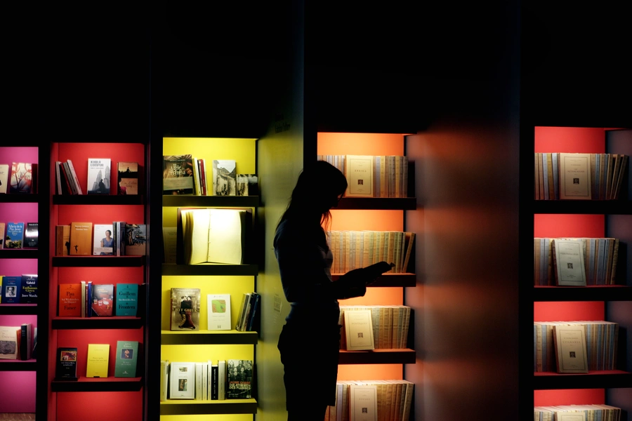 A woman looks into a book at the exhibition of "Catalan culture" at the Frankfurt book fair, October 9, 2007. 
