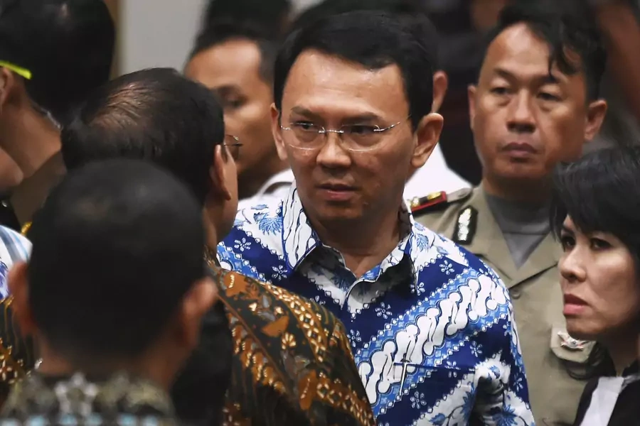 Jakarta's Christian governor Basuki Tjahaja Purnama, popularly known as Ahok, speaks to his lawyers after the guilty verdict in his blasphemy trial in Jakarta on May 9, 2017. 