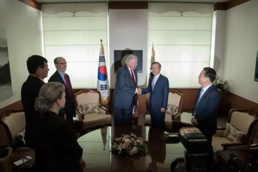 U.S. Deputy Secretary of State Thomas Shannon shakes hands with South Korean First Vice Minister of Foreign Affairs Lim Sung-Nan at the Foreign Ministry in Seoul, South Korea June 14, 2017.