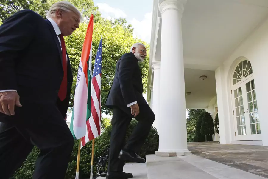 U.S. President Donald J. Trump (L) and India's Prime Minister Narendra Modi head back to the Oval Office after delivering joint statements in the Rose Garden of the White House in Washington, DC, June 26, 2017.