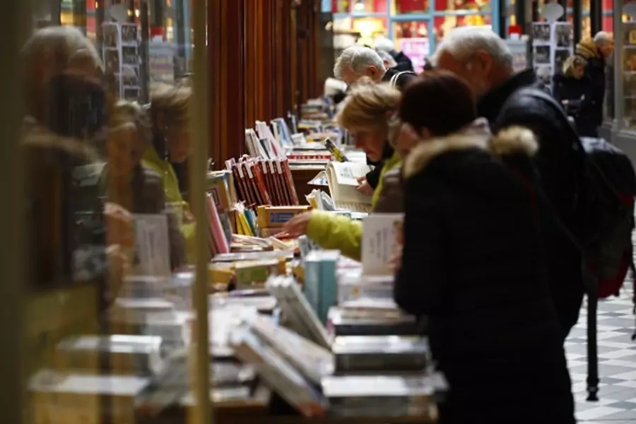 Shoppers peruse books in the Passage Jouffroy in Paris