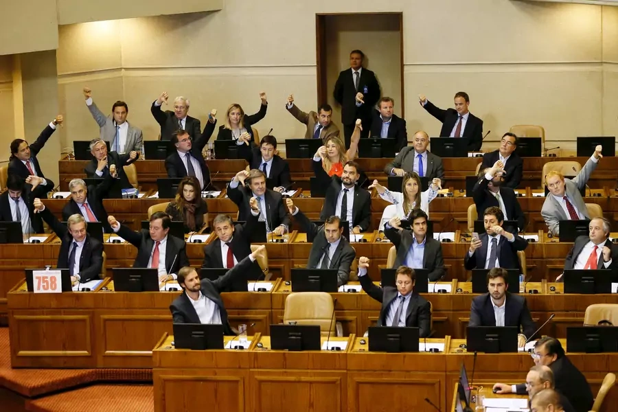 Deputies of right-wing party gesture in a sign of rejection during a session at the congress for a draft law of the government, which seeks to ease the country's strict abortion ban, in Valparaiso, Chile March 17, 2016.