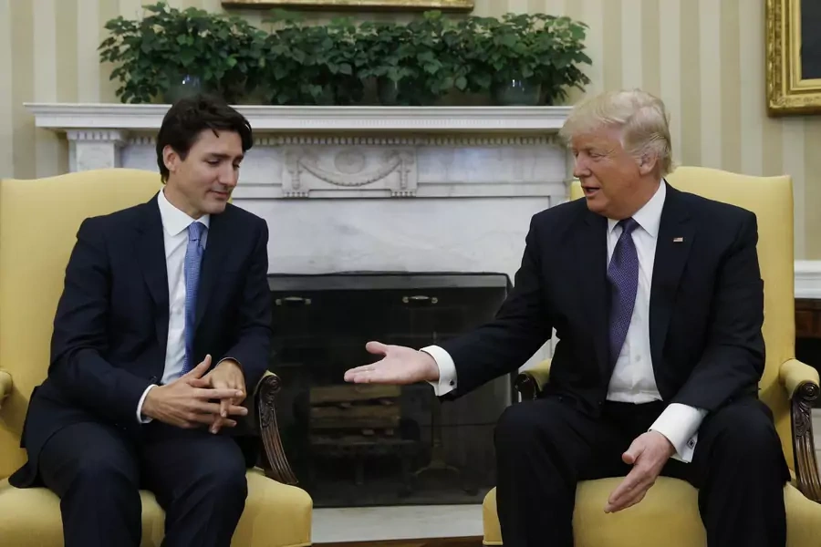 Canadian Prime Minister Justin Trudeau (L) is greeted by U.S. President Donald Trump in the Oval Office at the White House in Washington.