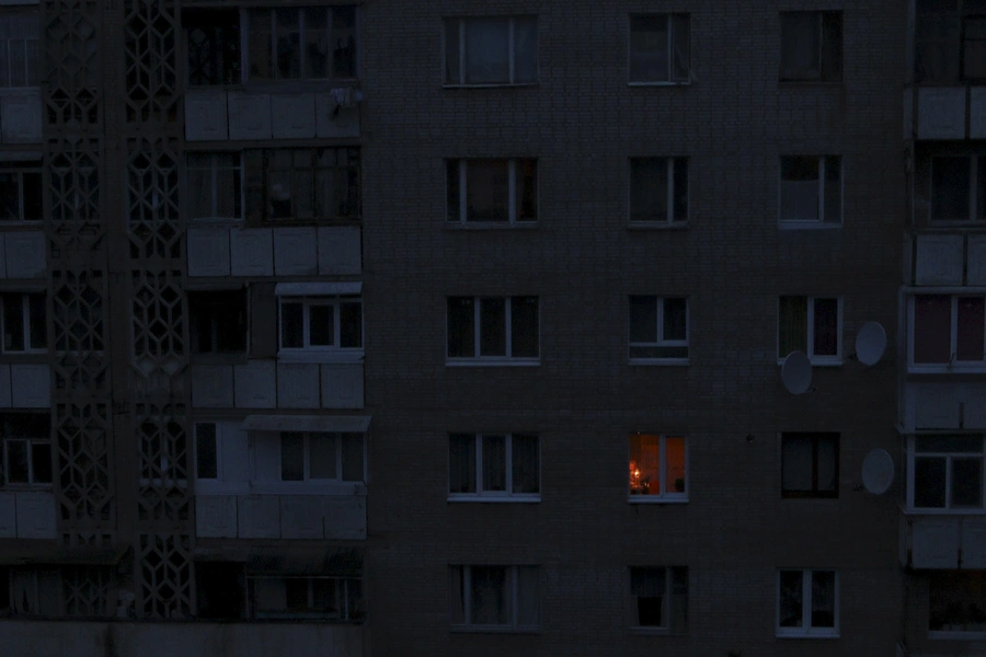 A single light illuminates a room during a blackout at a residential building in Simferopol, Crimea November 24, 2015.