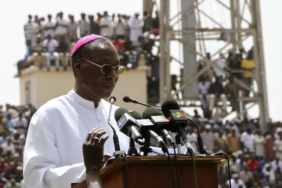 Archbishop Jean Zerbo speaks to Muslims and members of other religions during a rally to help calm the political situation in Mali, in Bamako March 31, 2012. He was one of five new cardinals elevated by the Pope on June 27.