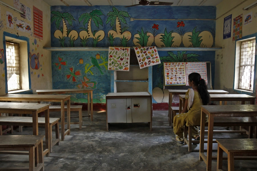 A 16-year-old girl sits inside a protection home on the outskirts of New Delhi November 9, 2012. She was working as a maid was rescued by Bachpan Bachao Andolan (Save the Childhood Movement), a charity which rescues victims of bonded labour. 